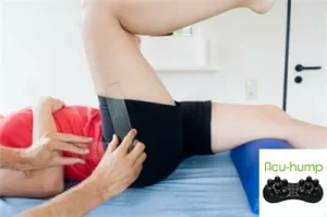 Piriformis syndrome relief lying on a therapy table, the therapist is examining his buttocks muscles
