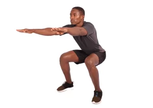 a man squats for piriformis syndrome relief