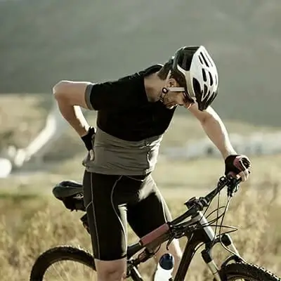 A cyclist with lower back pain