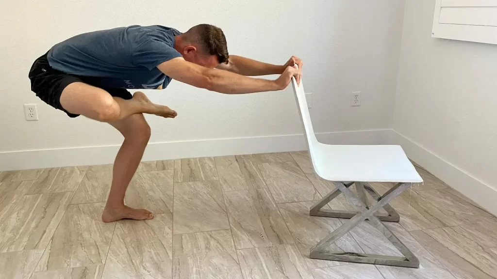 standing figure 4 piriformis stretch with chair