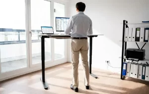 a man standing work for buttock pain relief
